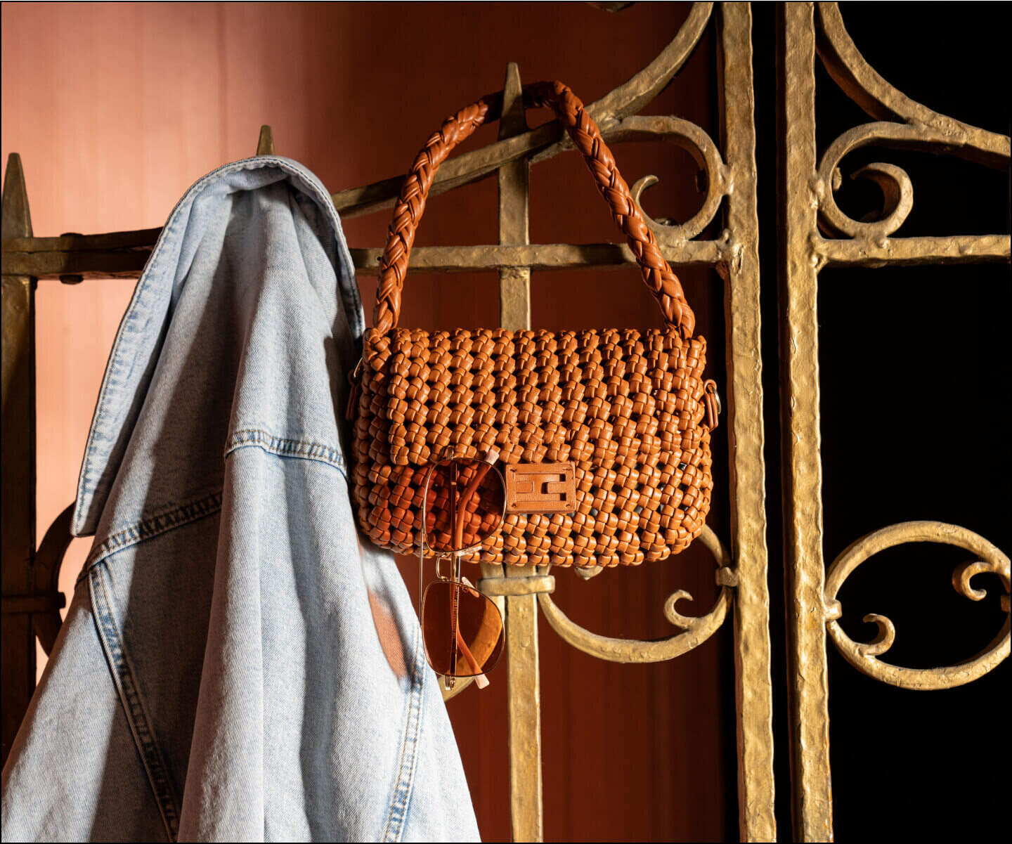 Jean jacket, purse, and sunglasses hanging up